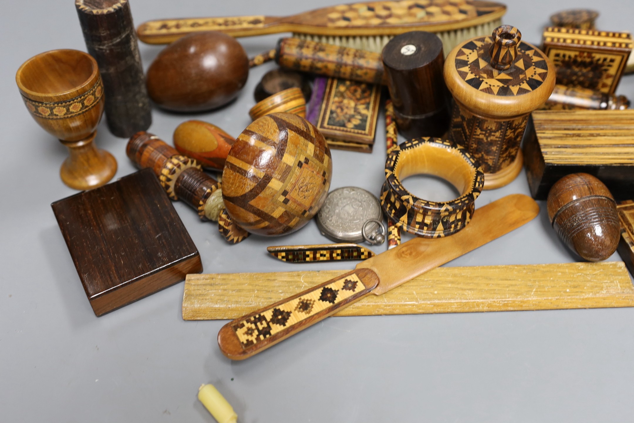 A selection of small Tunbridge ware sewing related items, boxes, letter opener, watch holder, napkin ring, unworked mosaic blocks and other related wood wares